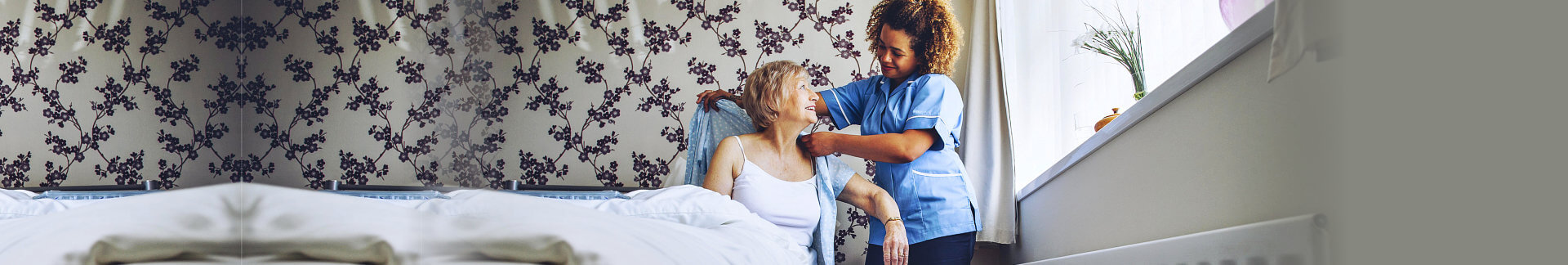 caregiver helping senior woman