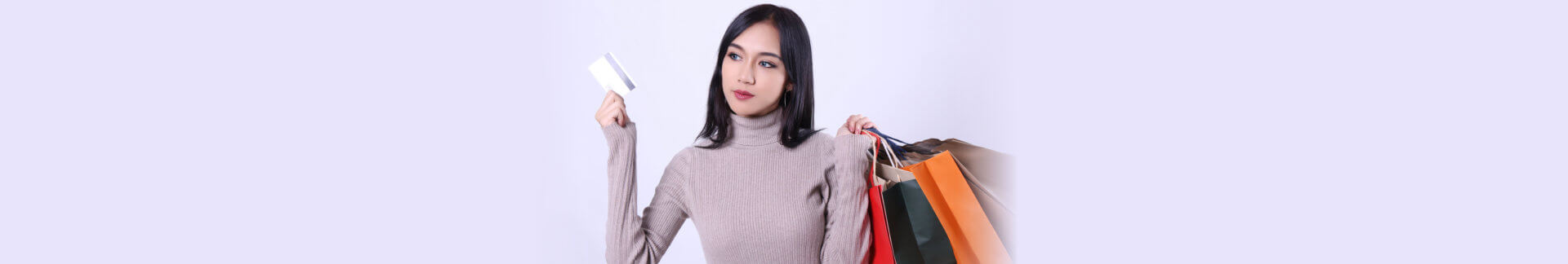 woman holding a card while shopping