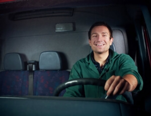 smiling man while driving 